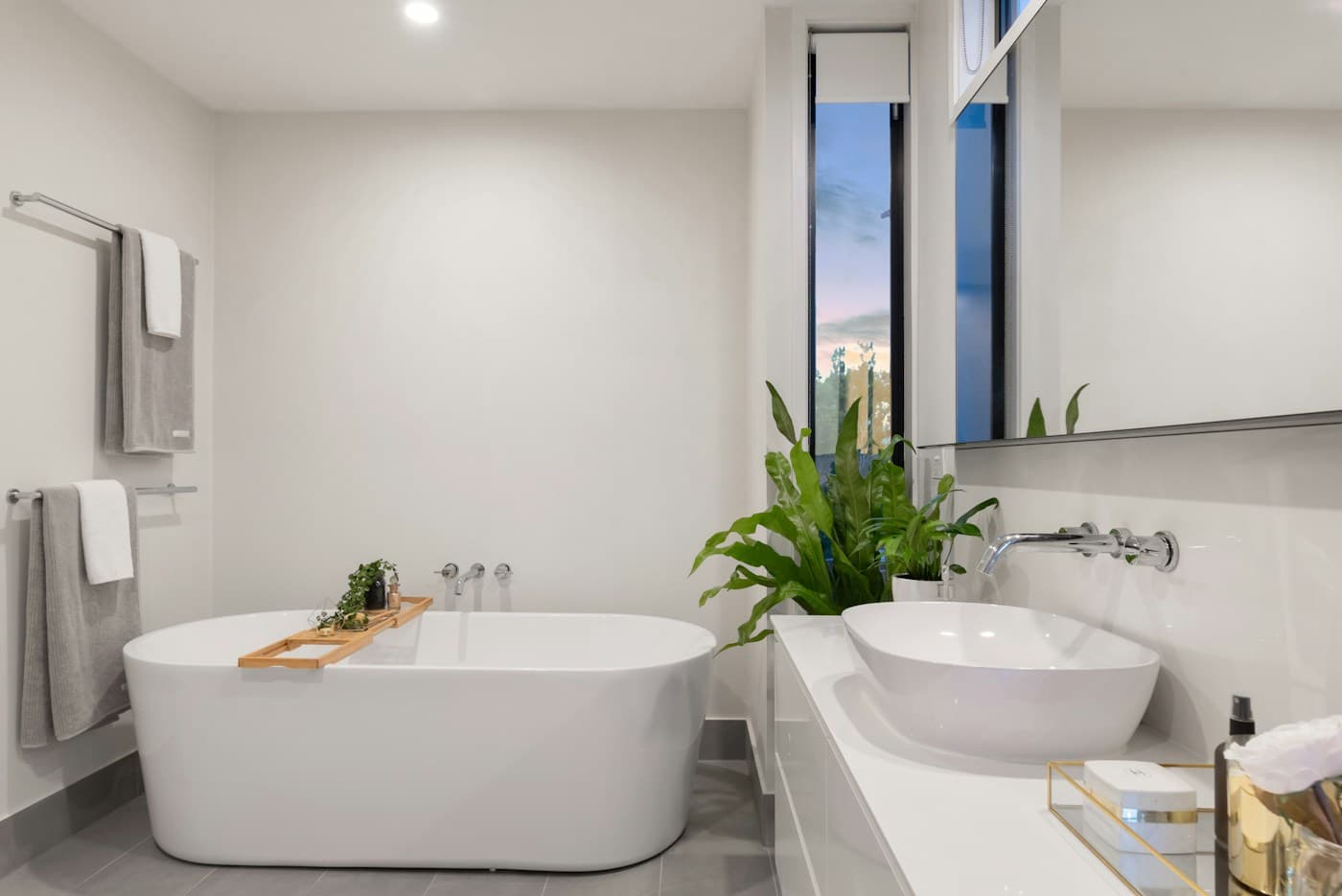 Calm bathroom with a freestanding bath and contemporary vanity